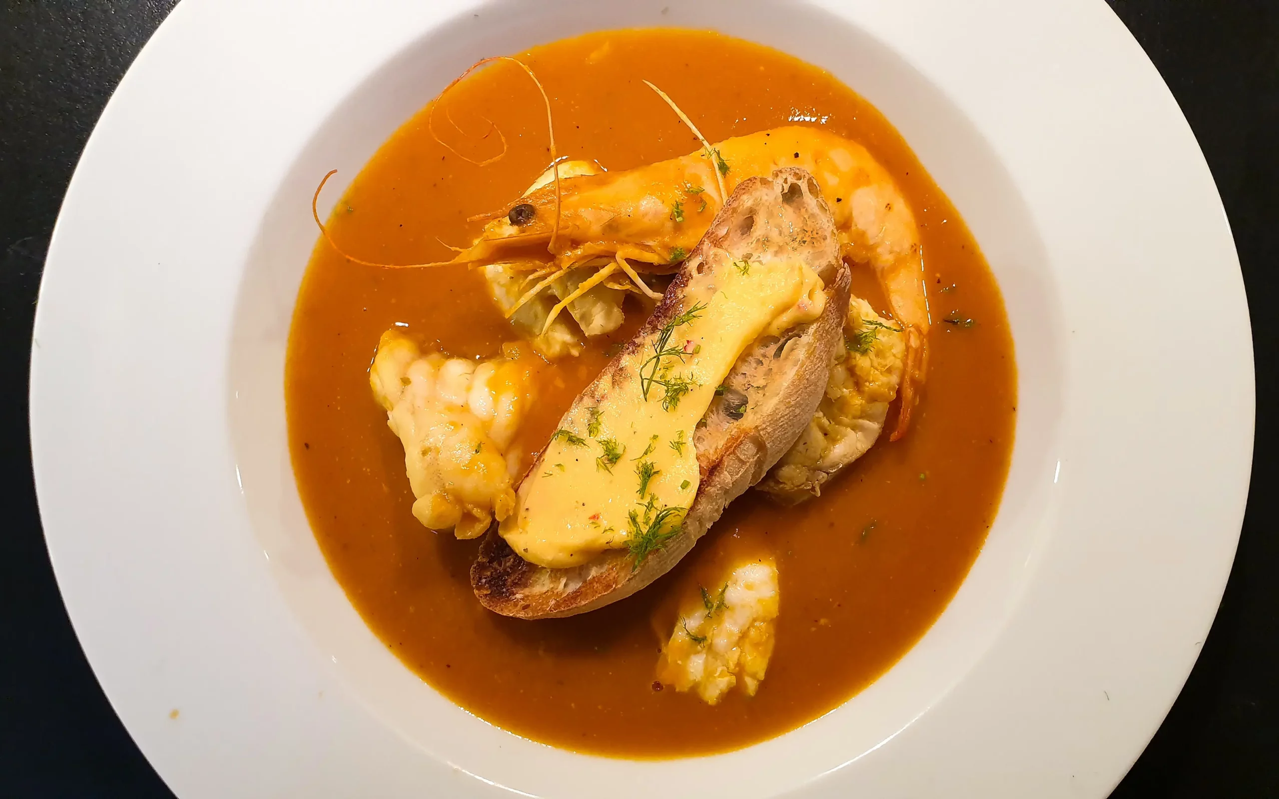 Bouillabaisse is a traditional French fish soup originally a stew made by Marseille fishermen, using the fish which they were unable to sell to restaurants or in the markets. Now a much loved favourite by restaurants and home cooks